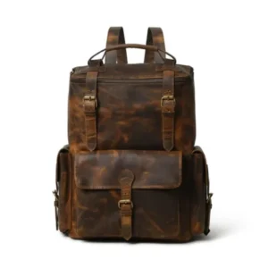 Rugged brown full-grain leather backpack for professionals featuring multiple buckled utility pockets and ergonomic design for business travel.