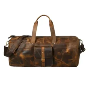 Rugged brown full-grain leather travel duffel bag with a front buckle pocket and reinforced top handles.